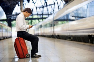 Businessman on Train Platform Text Messaging